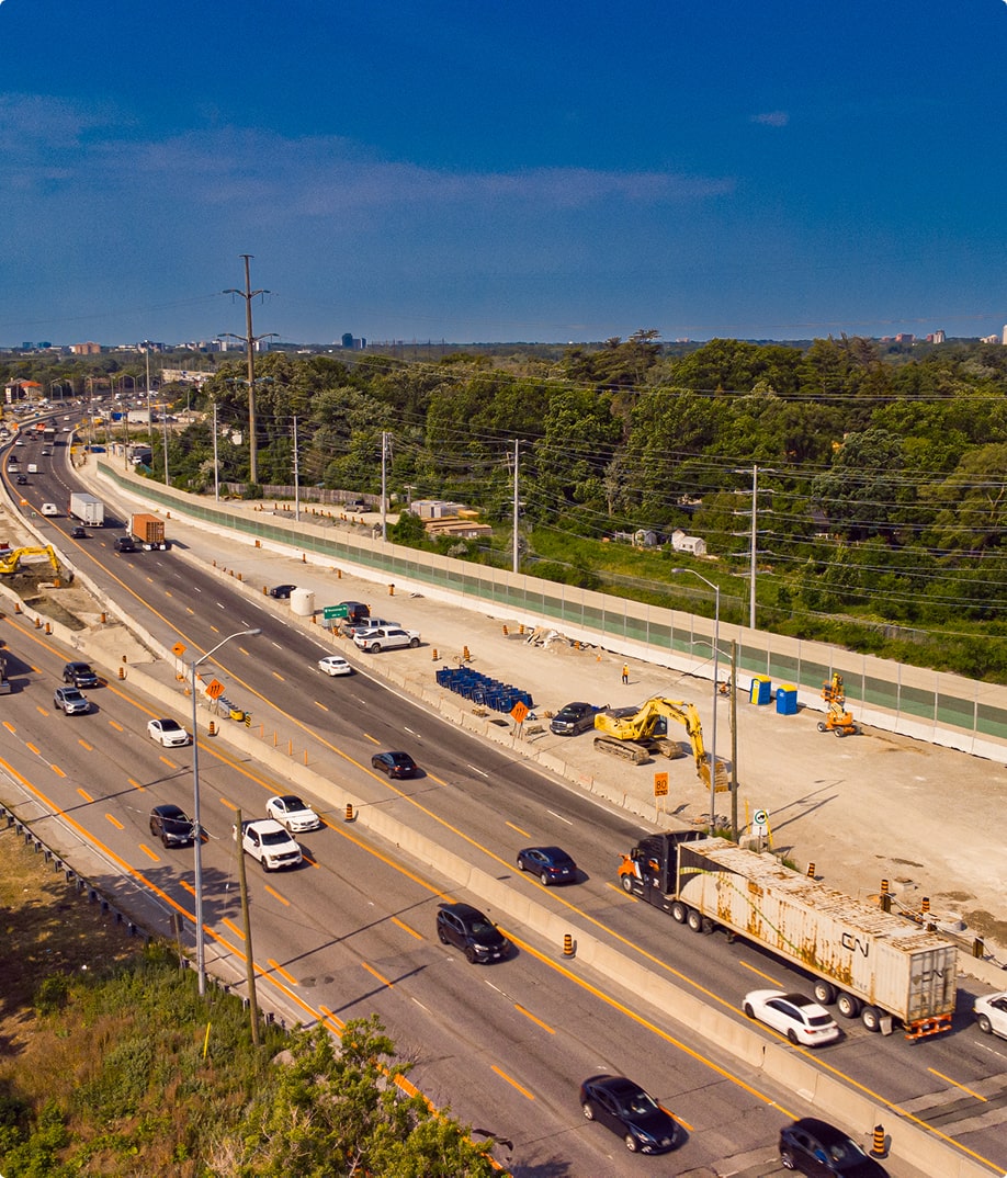 Birds eye view of construction site with new noise barrer wall