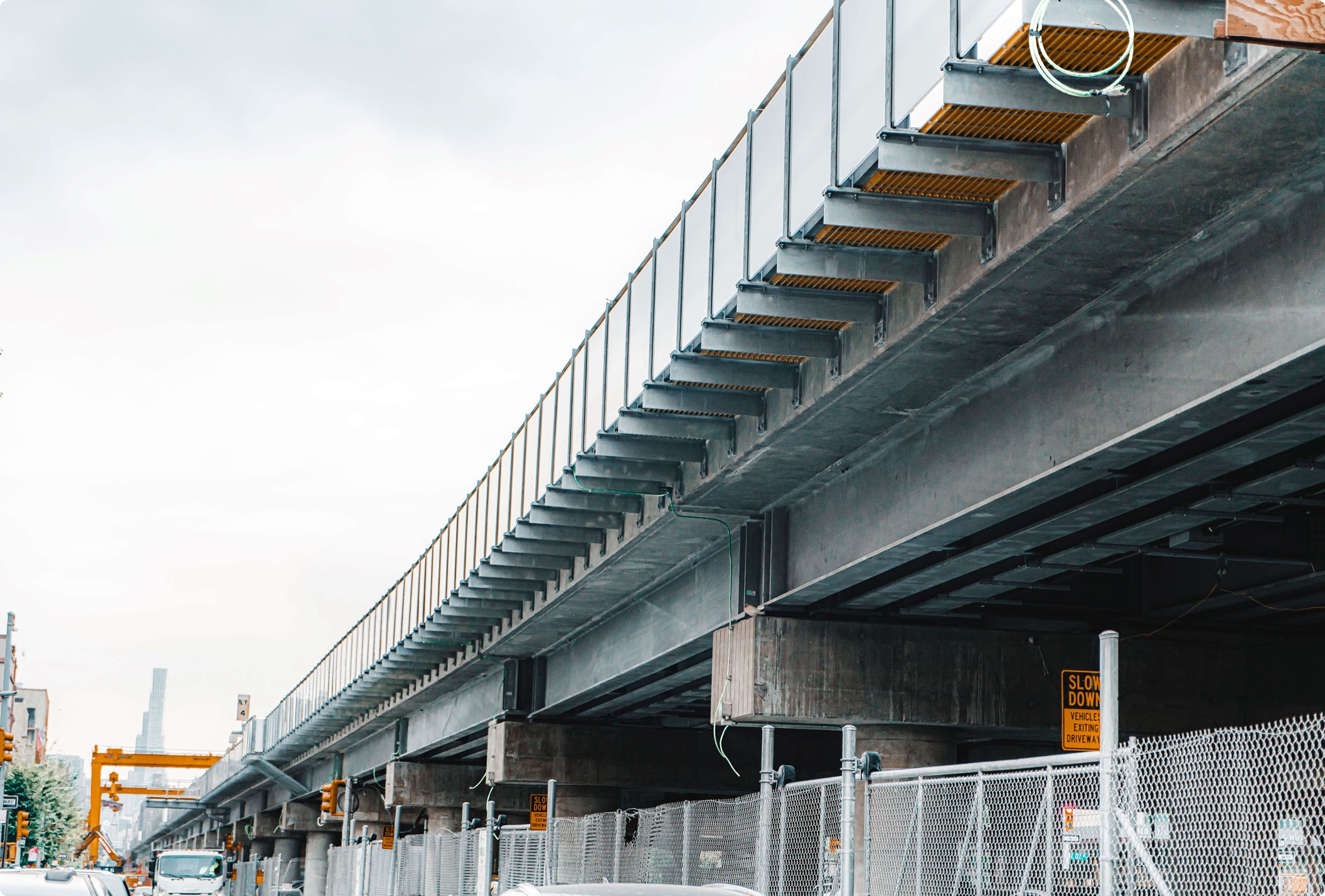 Raised highway with a transparent noise barrier