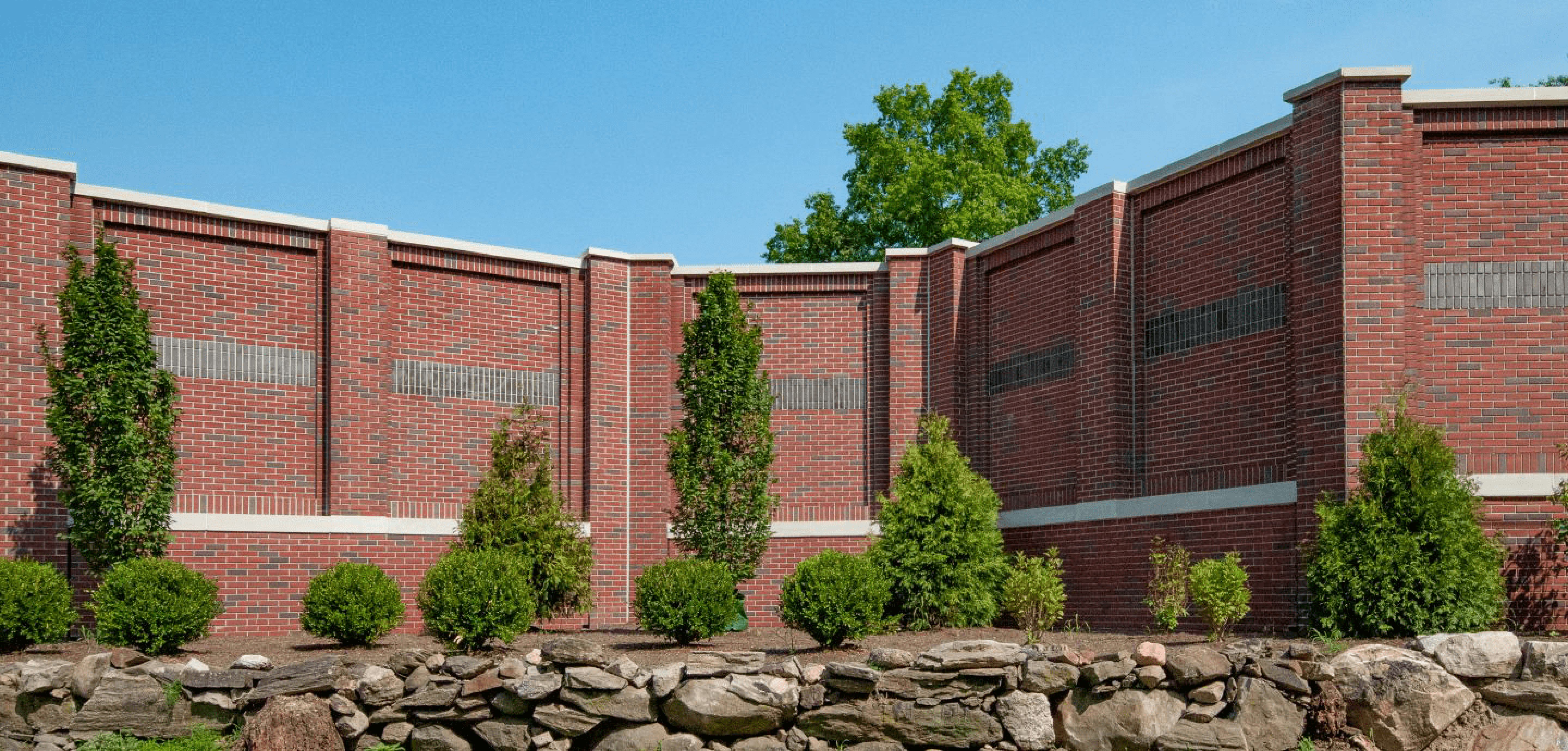 Red brick noise barrier wall